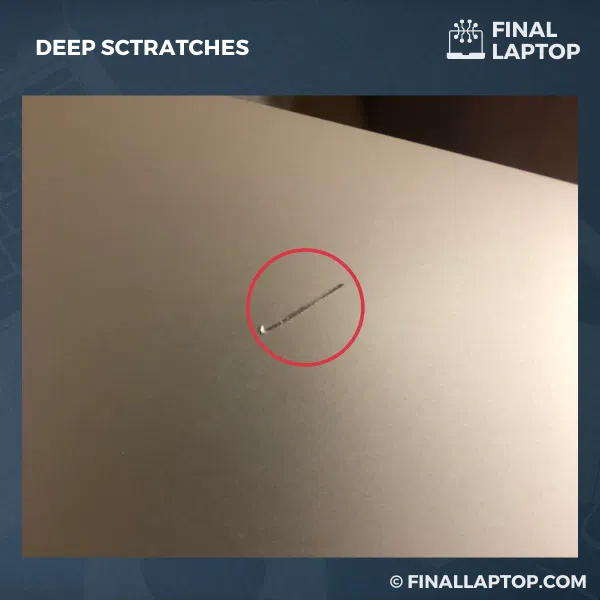 Deep Scratches on Aluminum Laptop